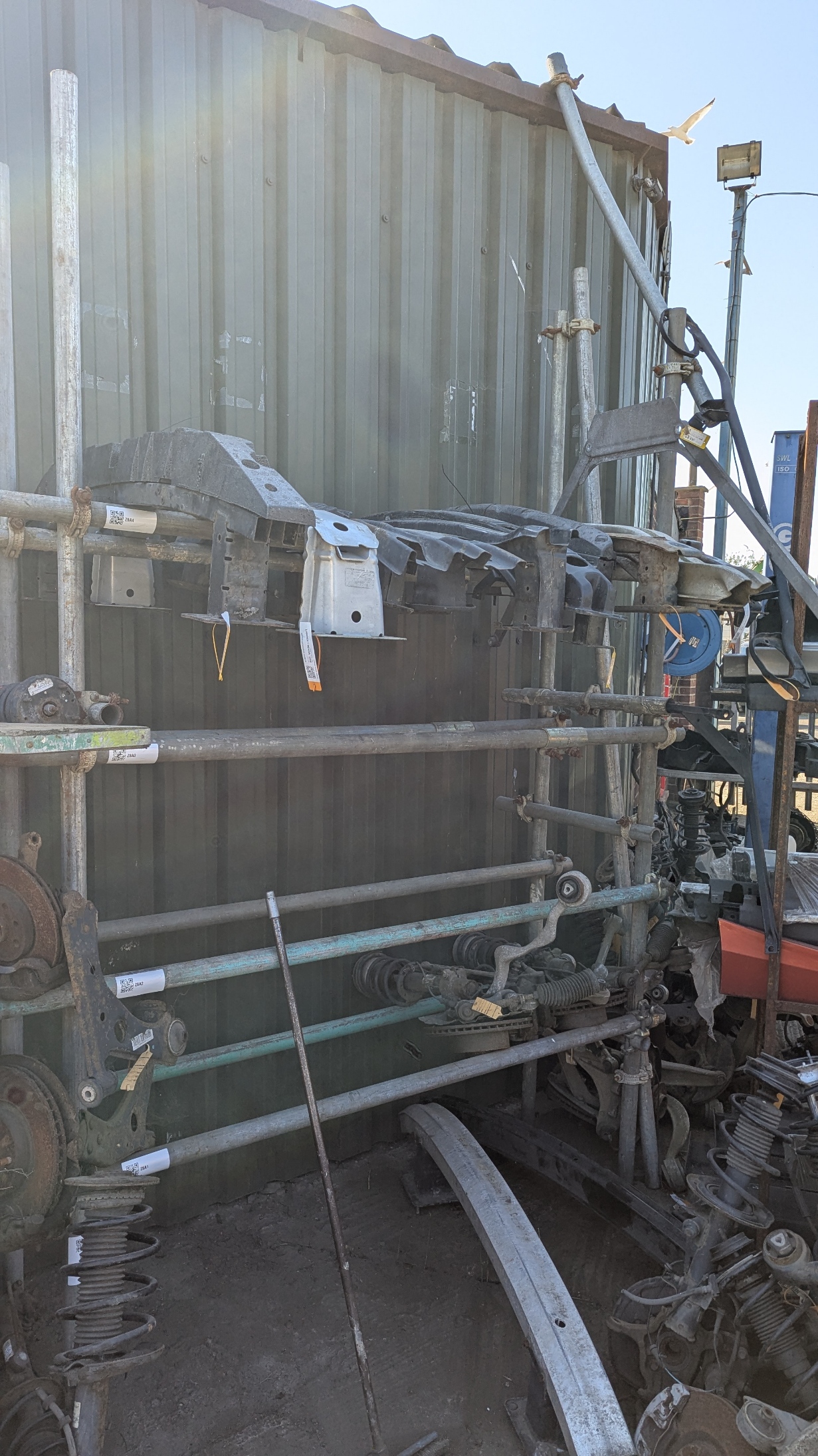 Sorted bumper reinforcement bars on labelled storage rack — Amber Autos Southend-on-Sea